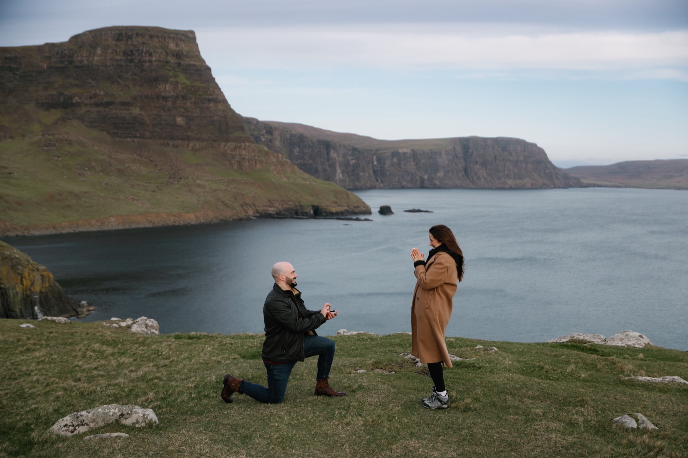 Daniele on one knee, the whole bay behind them