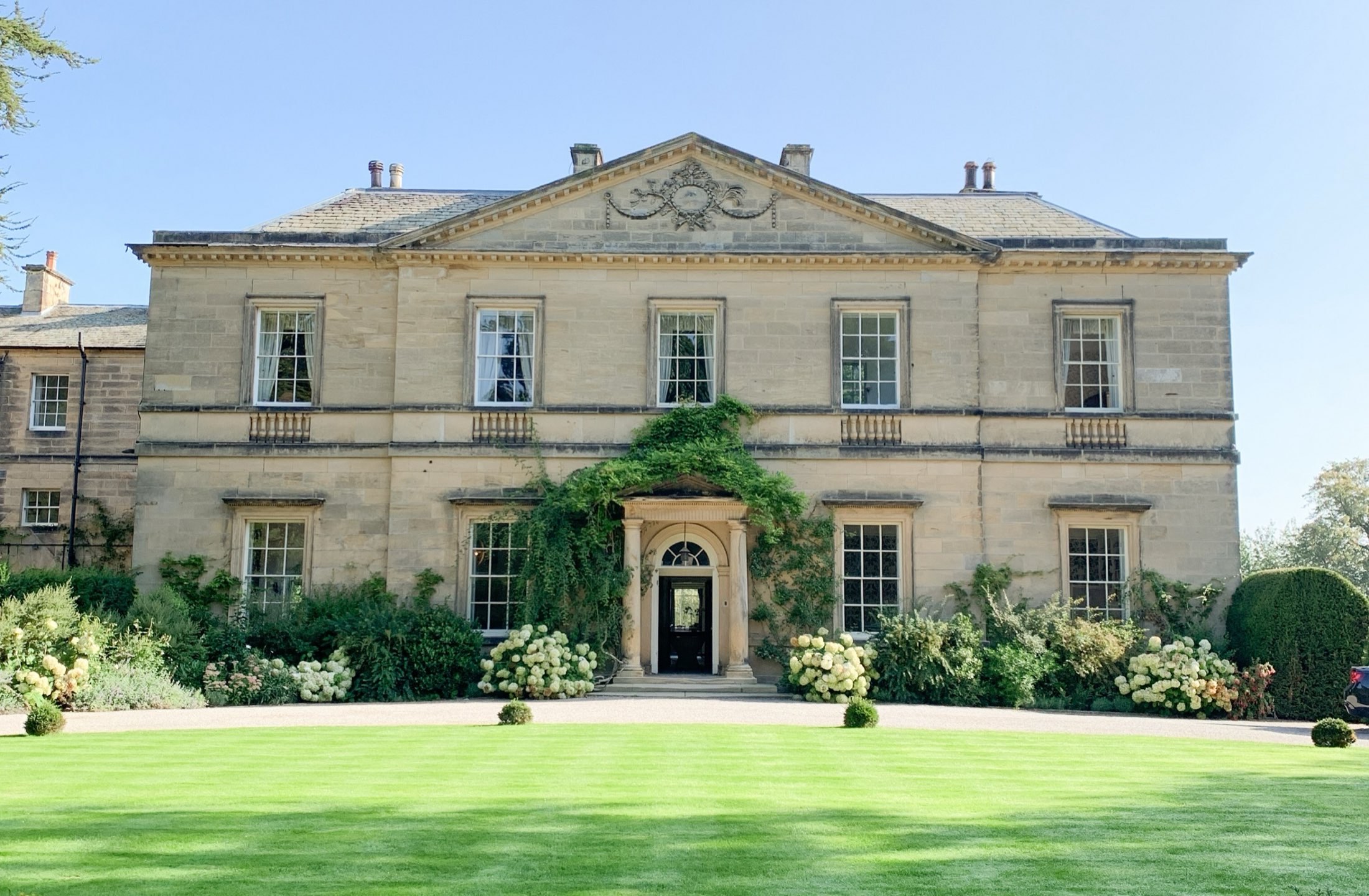 The Georgian main house at Middleton Lodge seen across the lawn