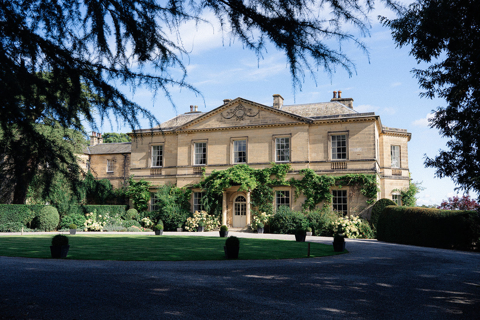 The Georgian main house seen across the lawn